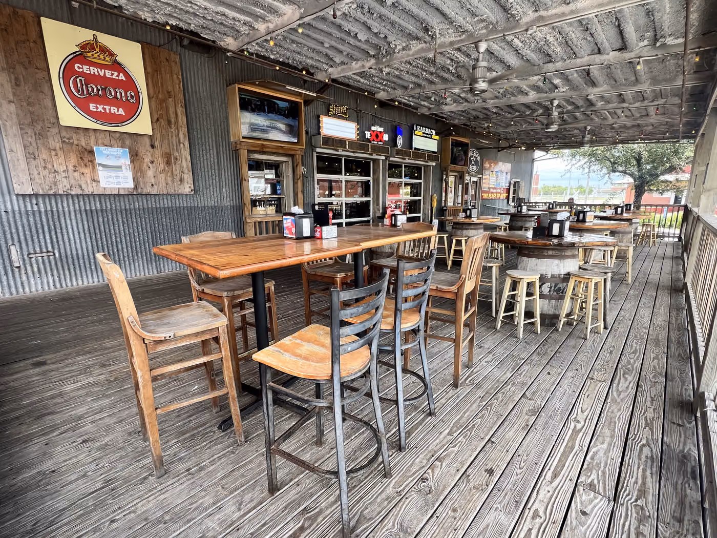 The covered deck with high tables at Brewster Street Downtown