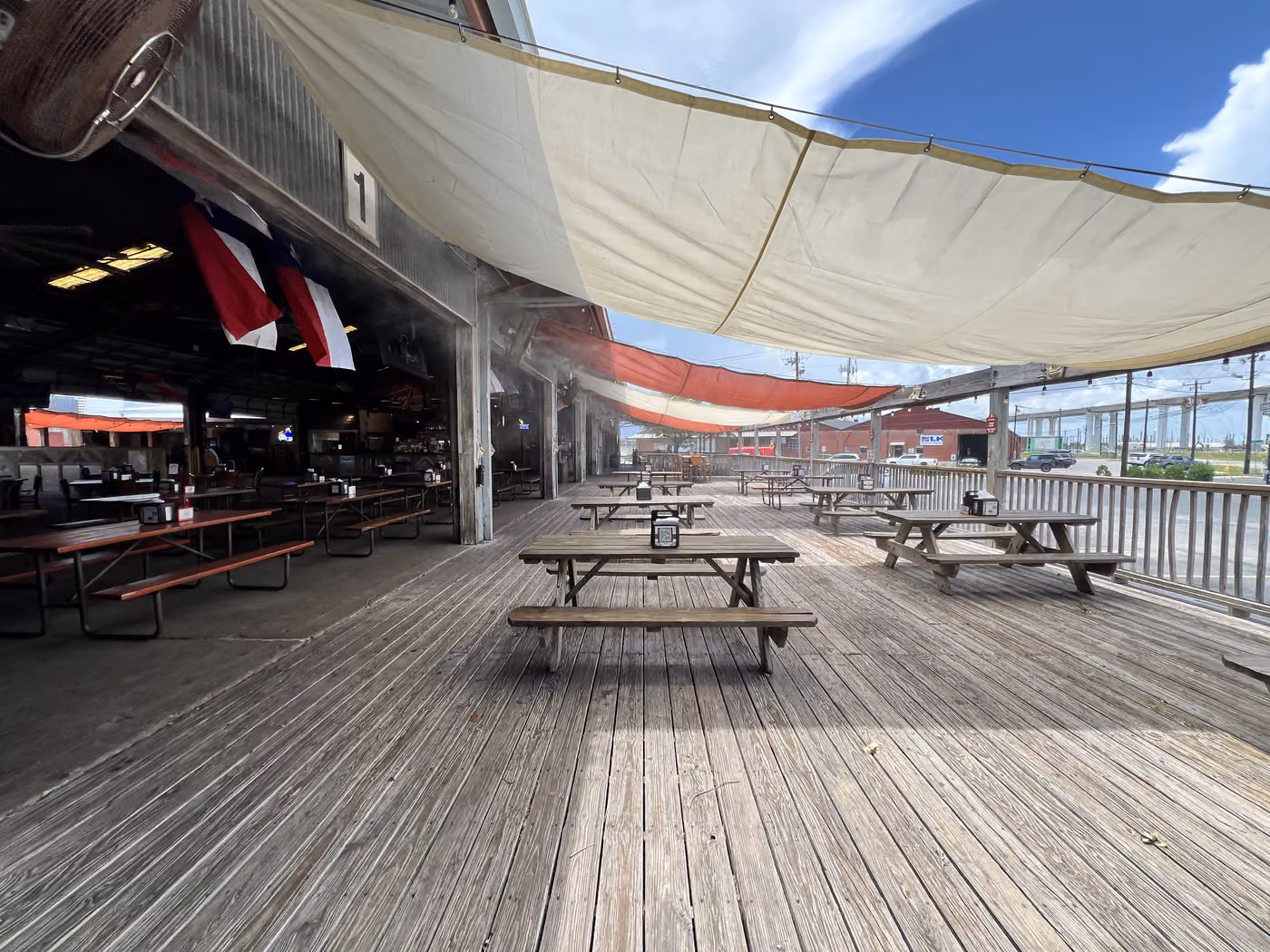 The icehouse deck under the sail shade at Brewster Street Downtown