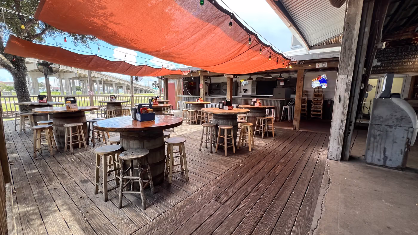The oyster deck under the orange sail at Brewster Street Downtown