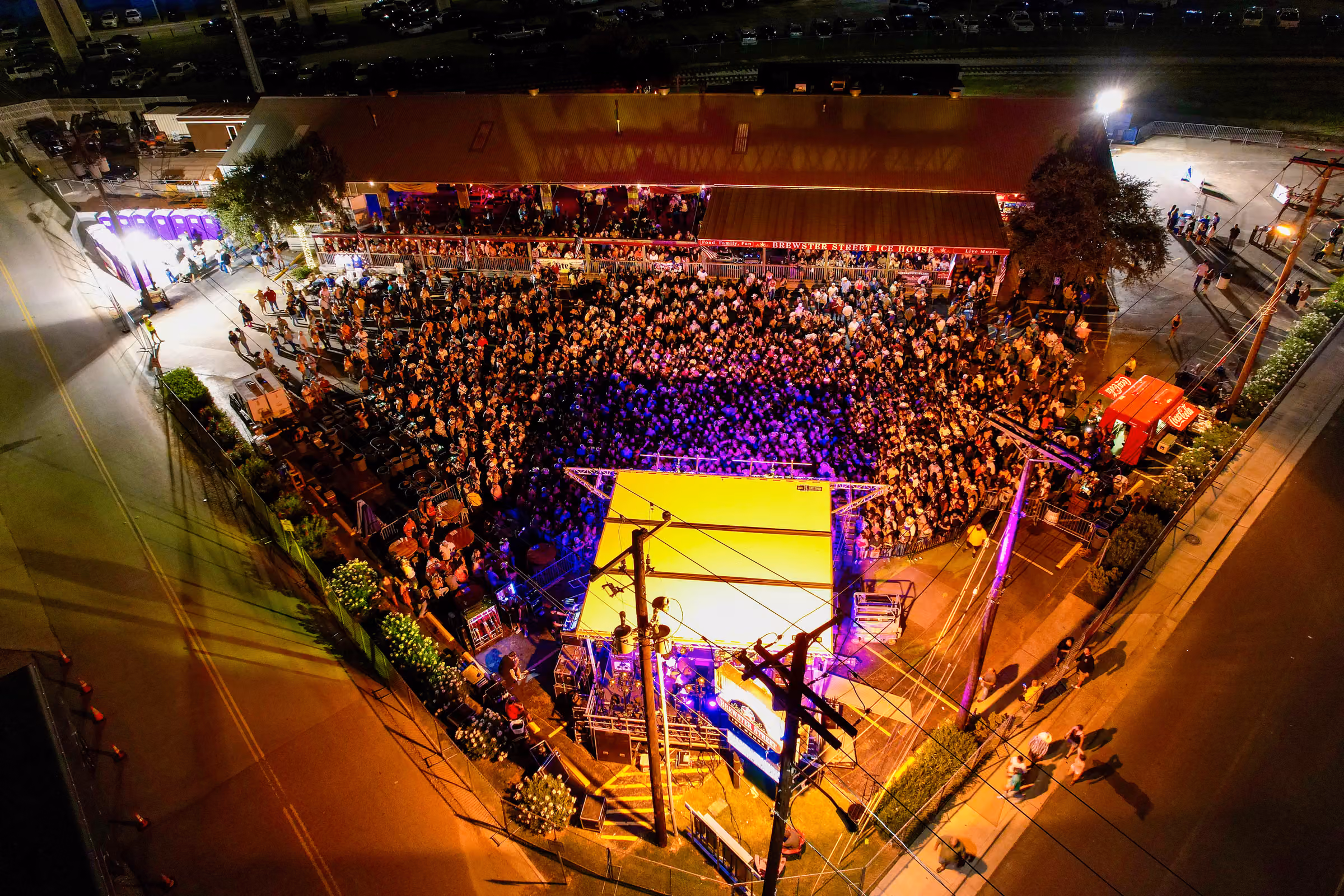 An aerial view of a night show in the Downtown lot