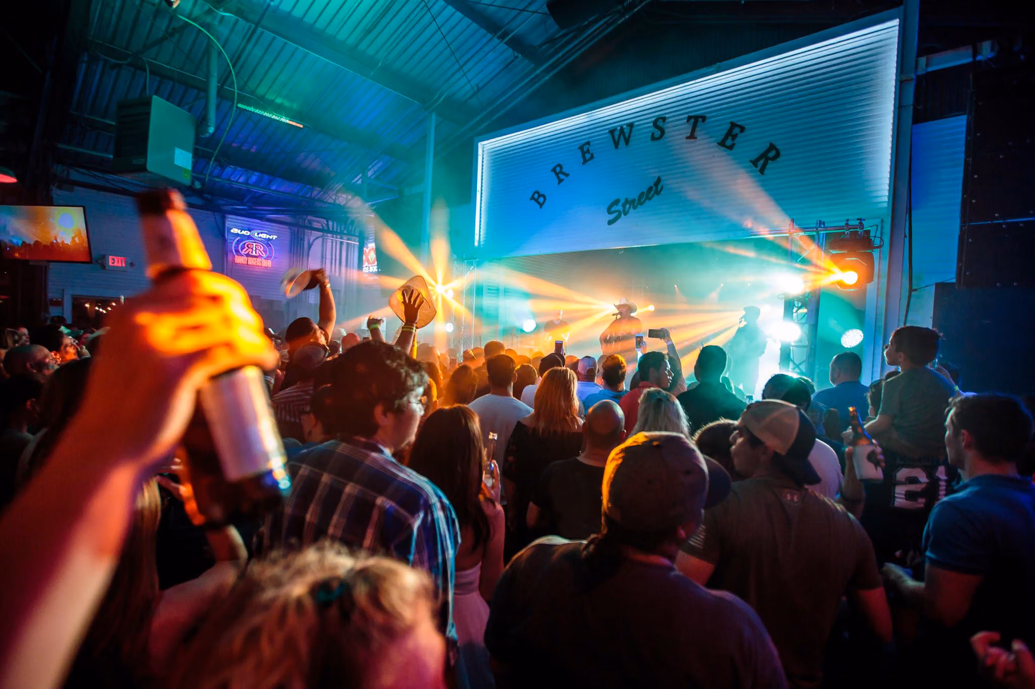The Brewster Street stage sign above the Downtown crowd
