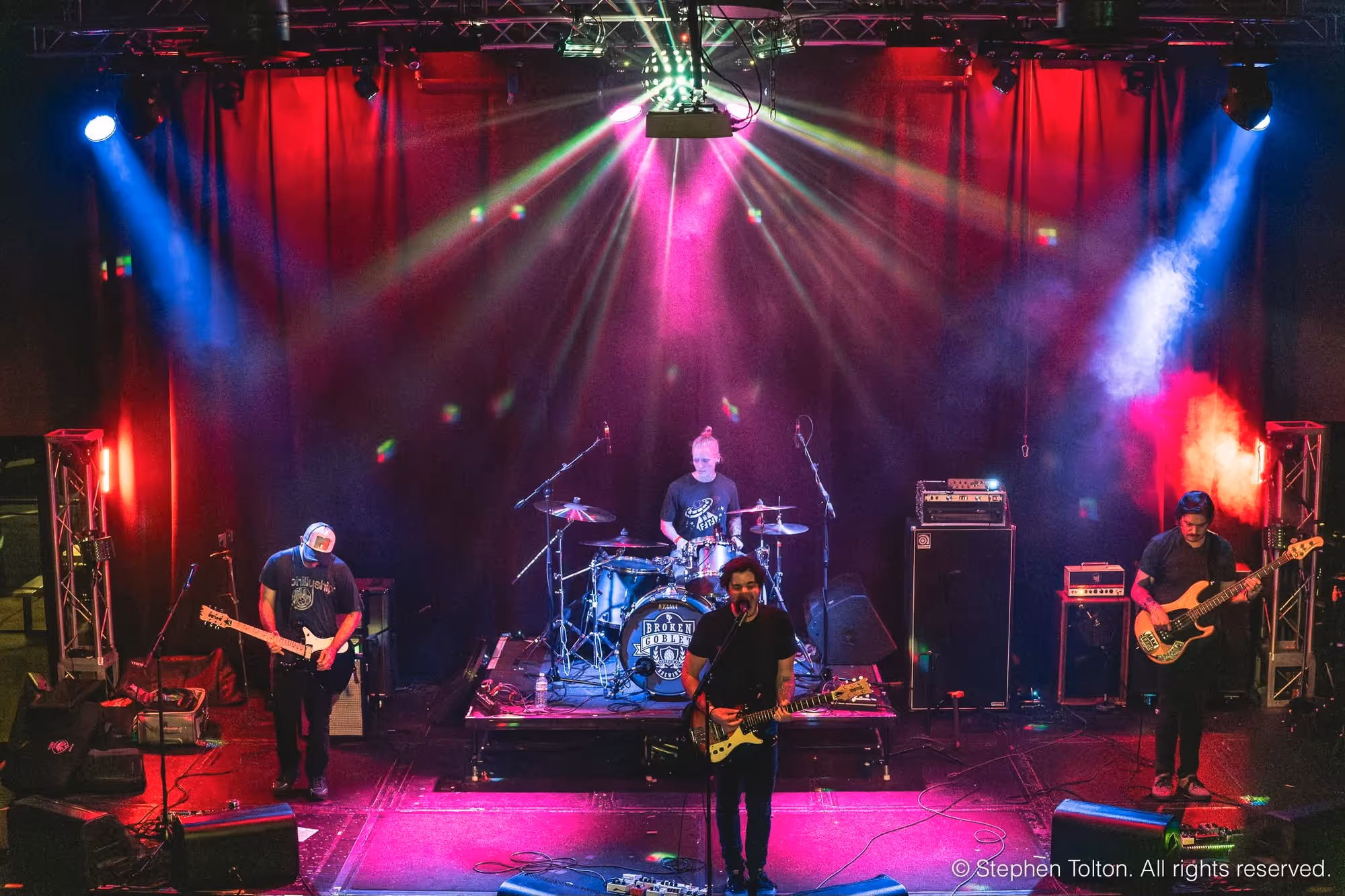 The Music Room stage under red neon