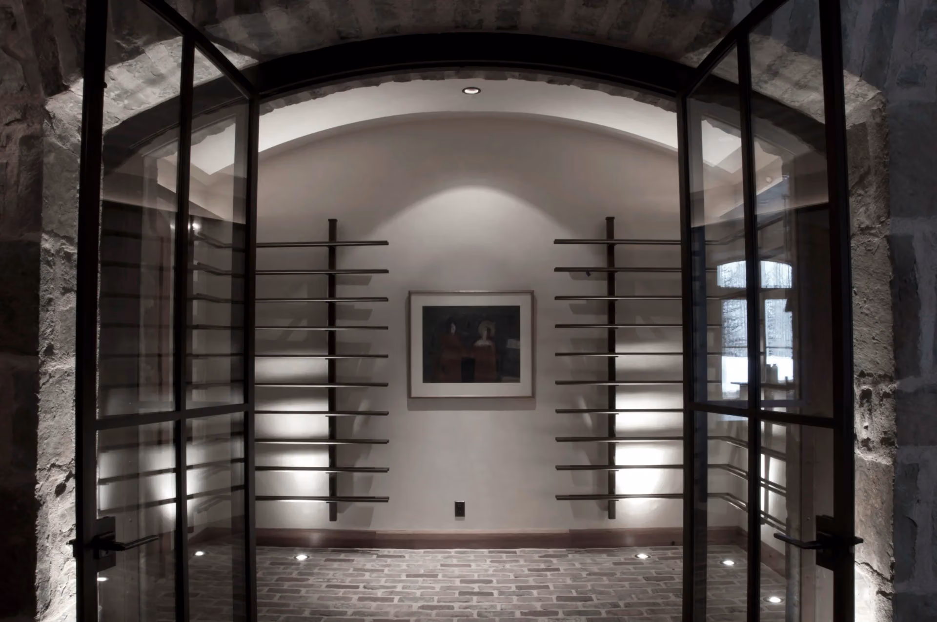 Glazed steel doors into a wine room