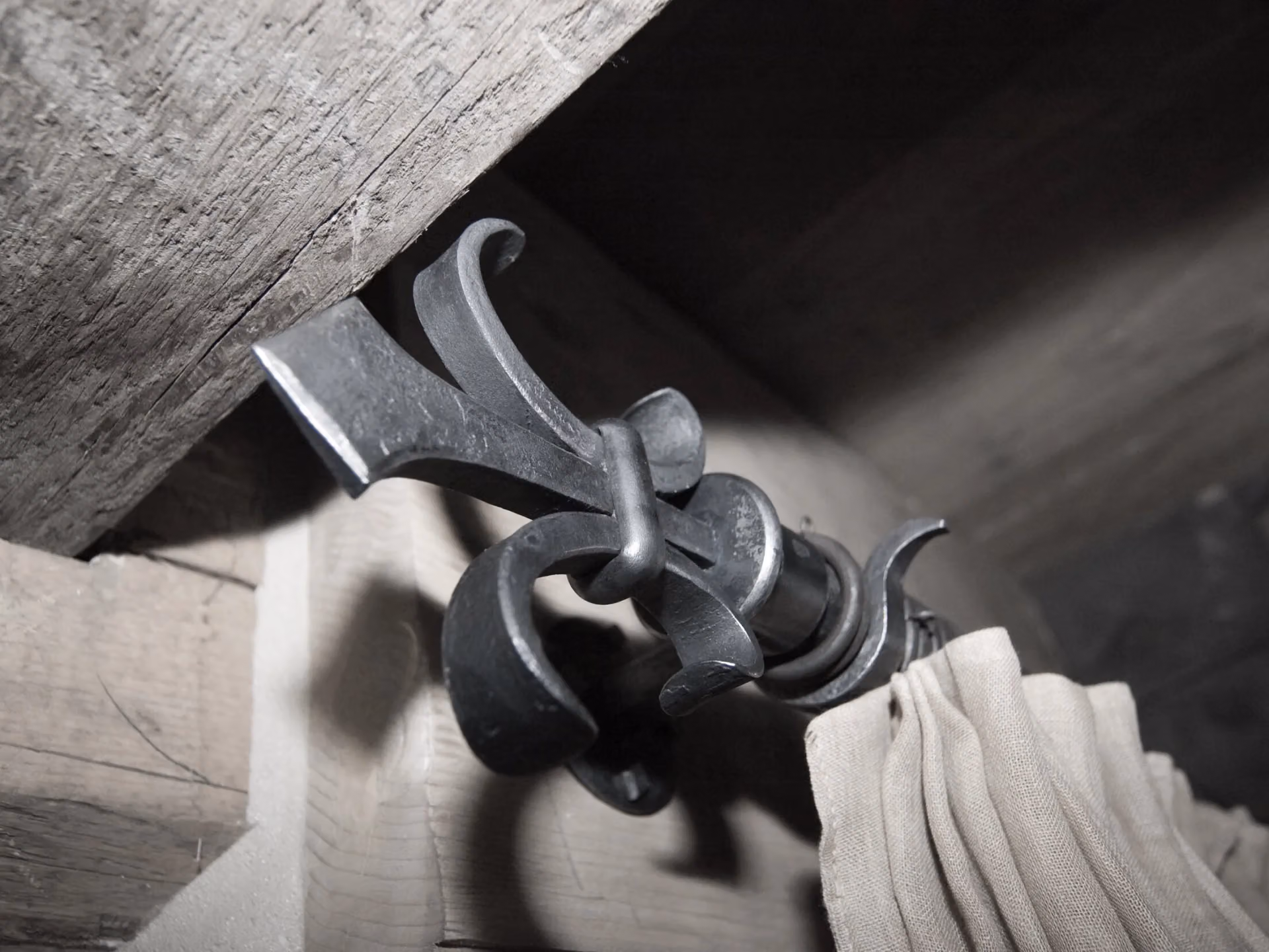 A forged curtain bracket