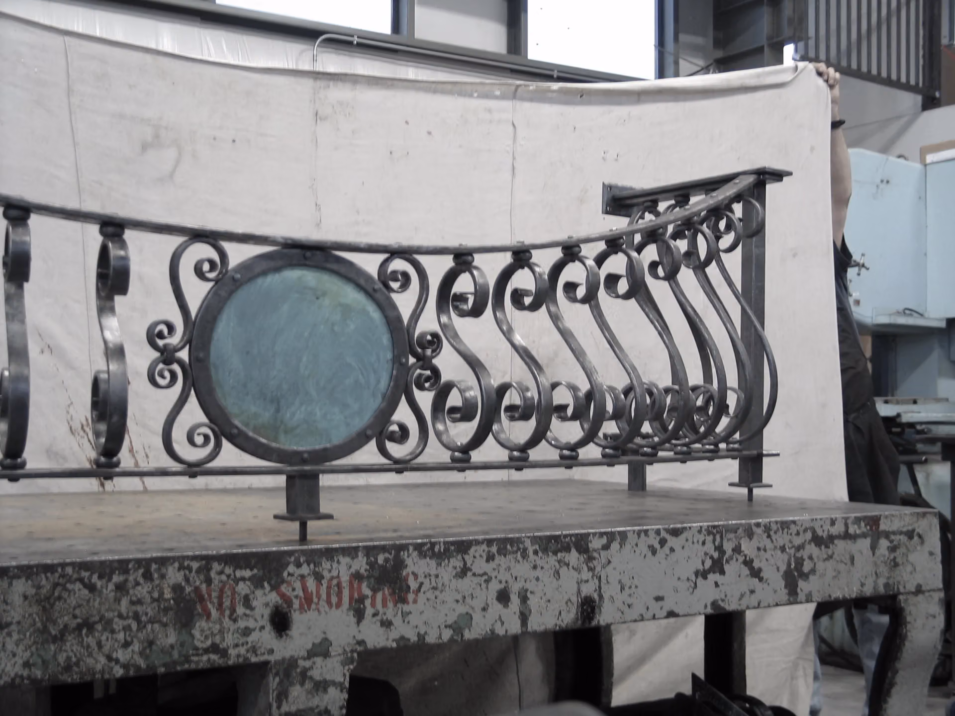 A forged railing on the bench in the Bennett Forgeworks shop