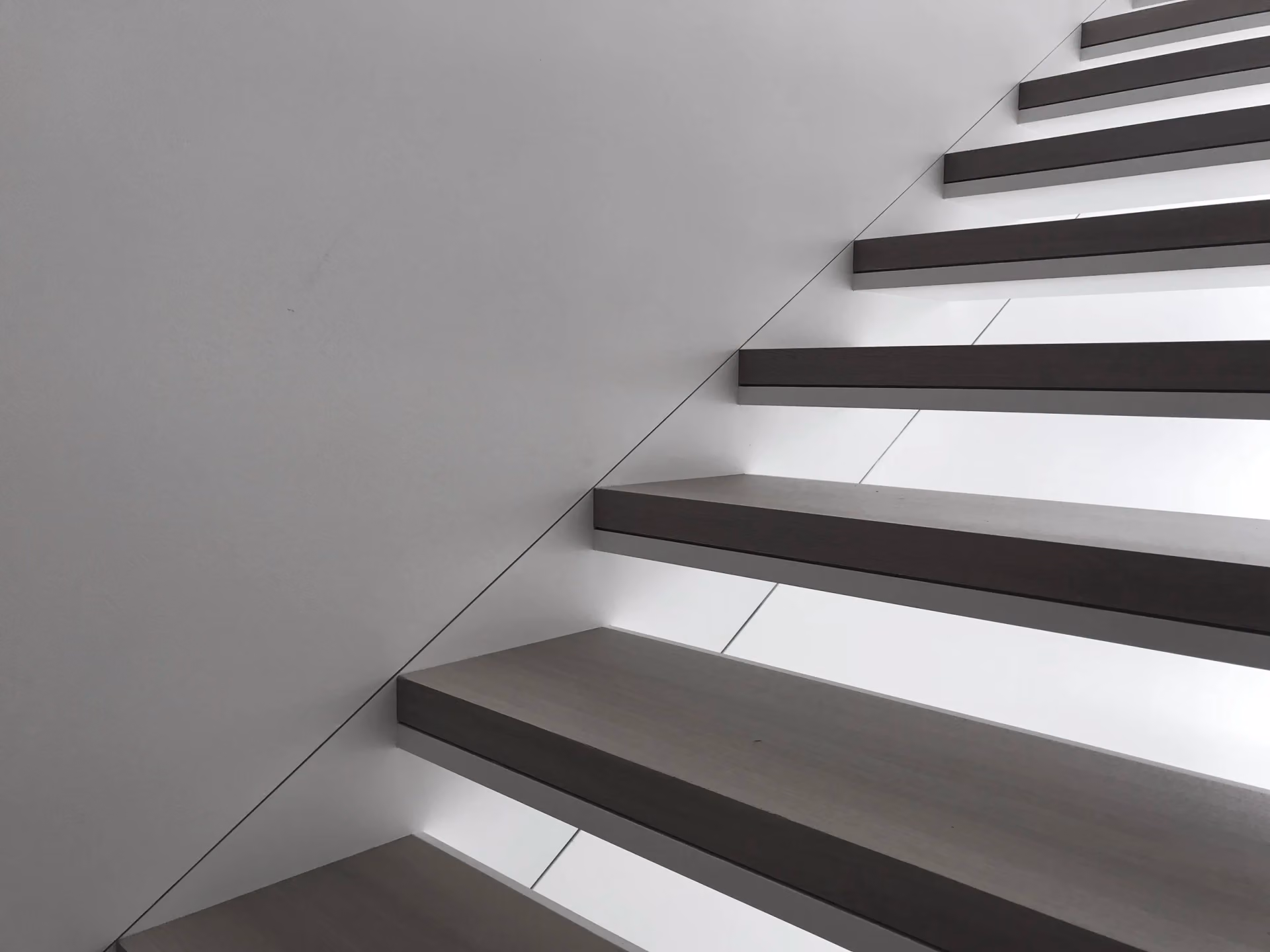 Floating stair treads with a steel rail