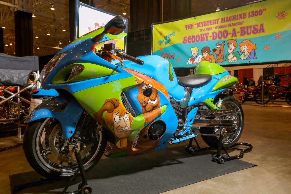 A Scooby-Doo themed Hayabusa in front of the Mystery Machine banner