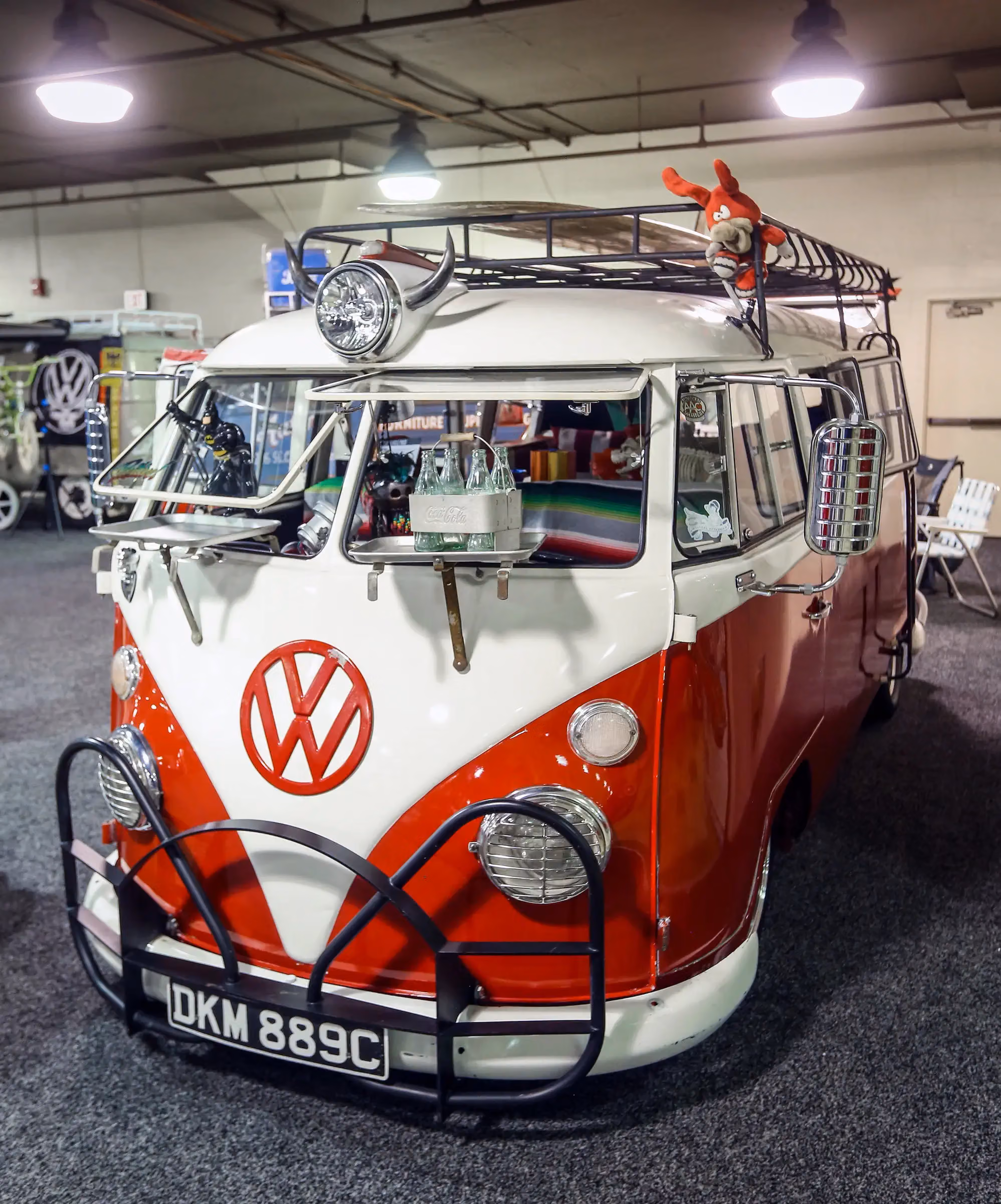 A red and white Volkswagen bus