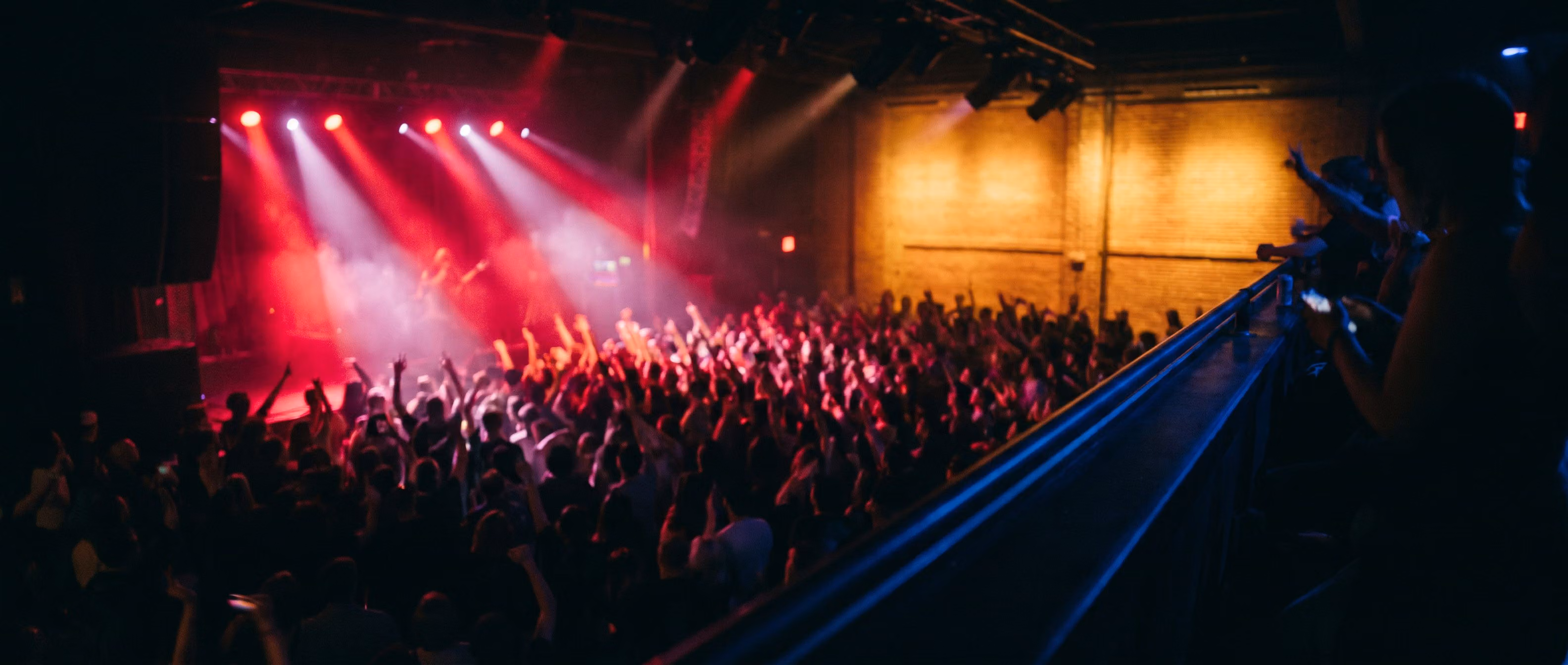 Crowd from the balcony under stage lights