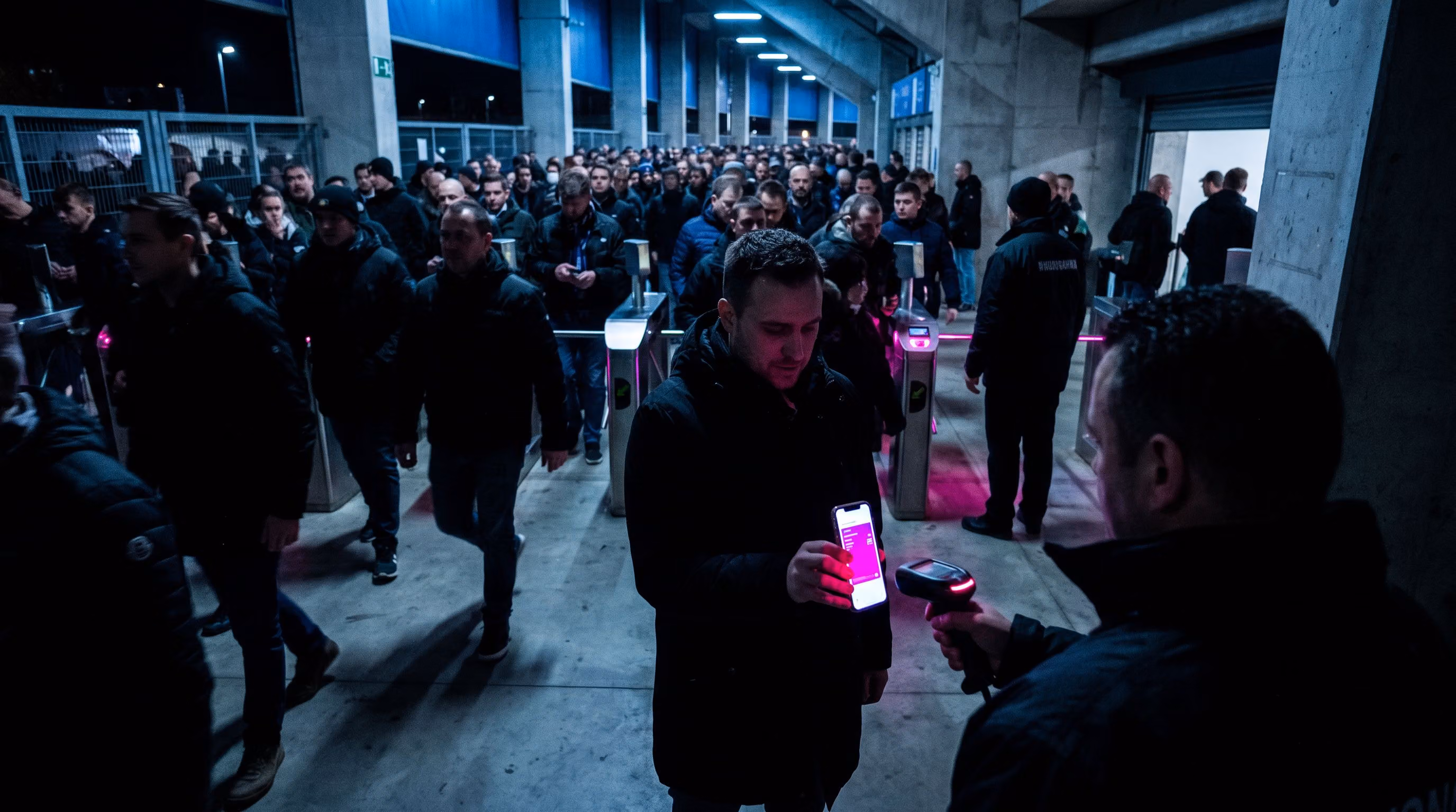 Fan scanning a mobile ticket at a stadium turnstile