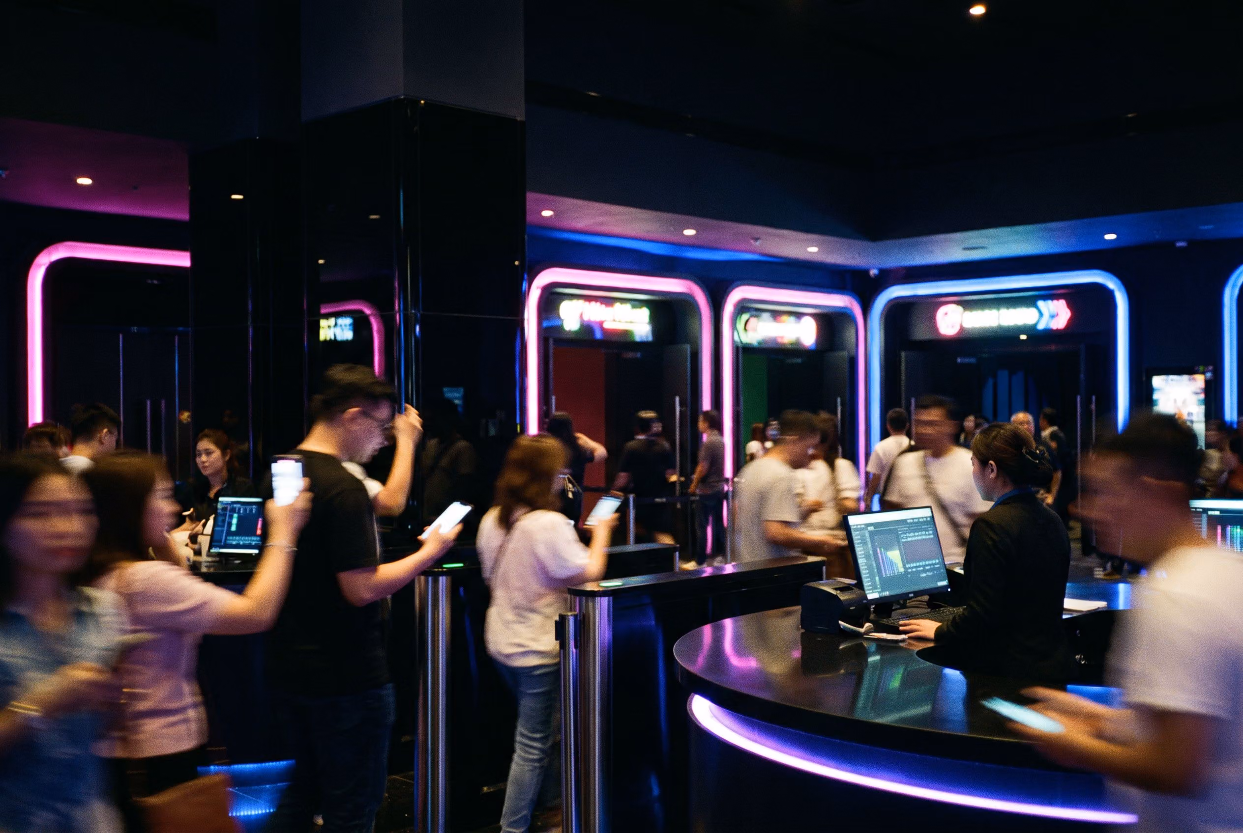 Guests scanning mobile tickets in the lobby of a multi-room venue