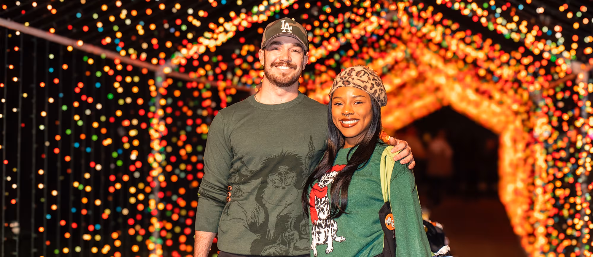 Friends under the holiday lights at a festive screening