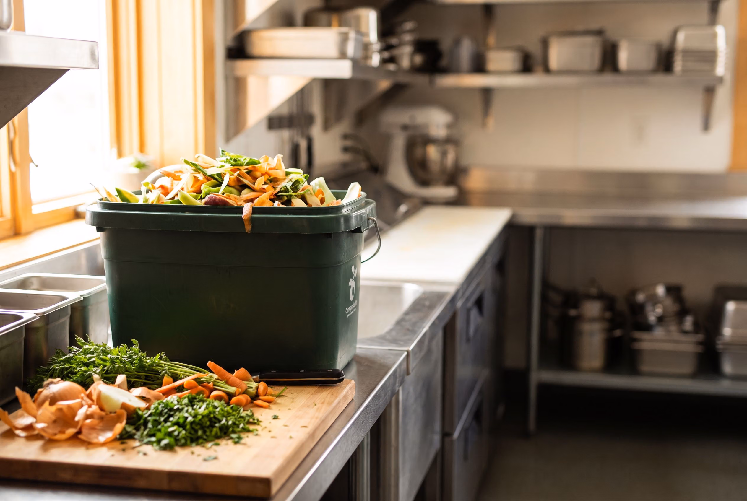 Food scrap collection bin in a restaurant kitchen