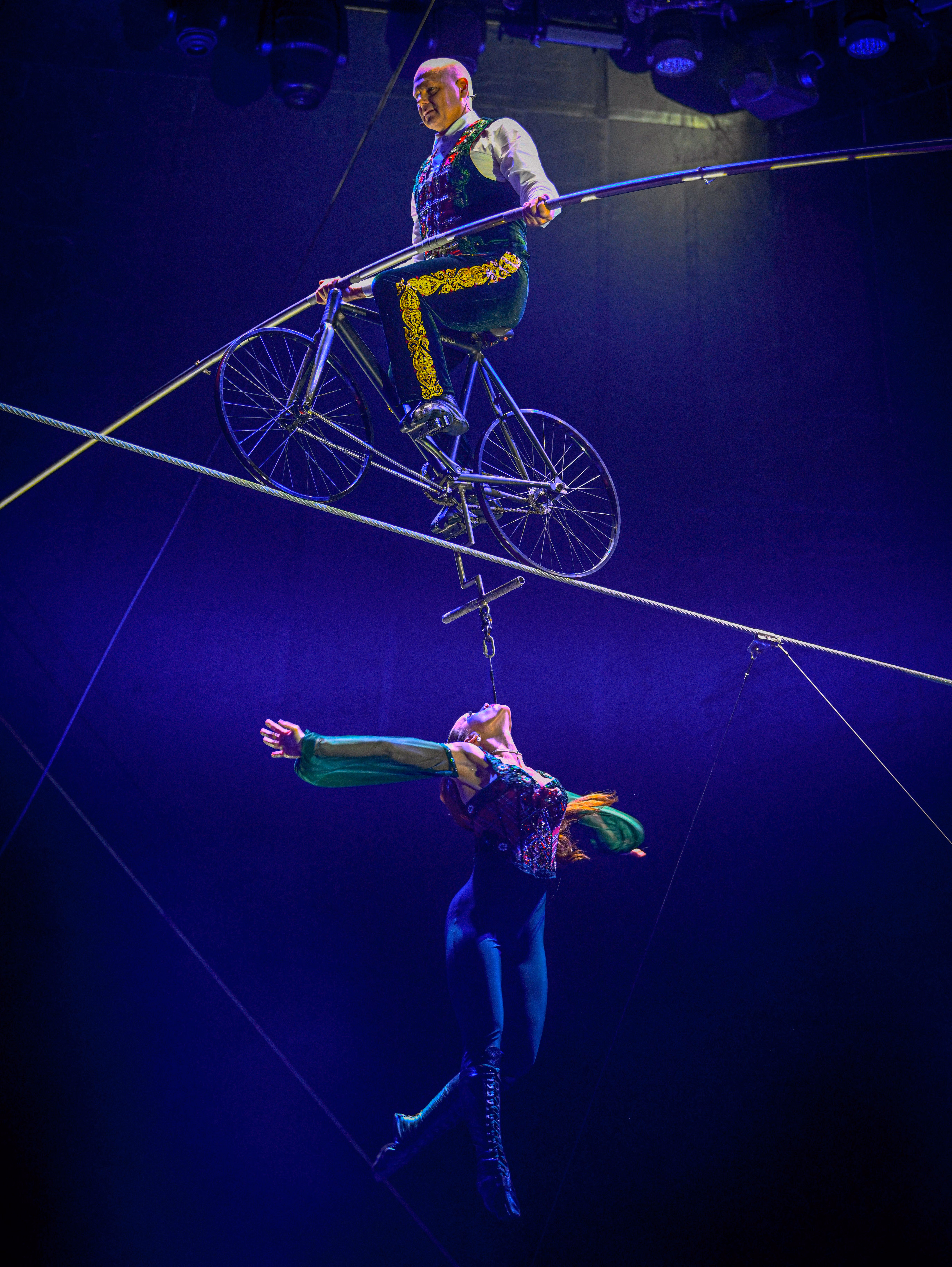 Nik Wallenda on the high wire with Erendira Wallenda suspended beneath him
