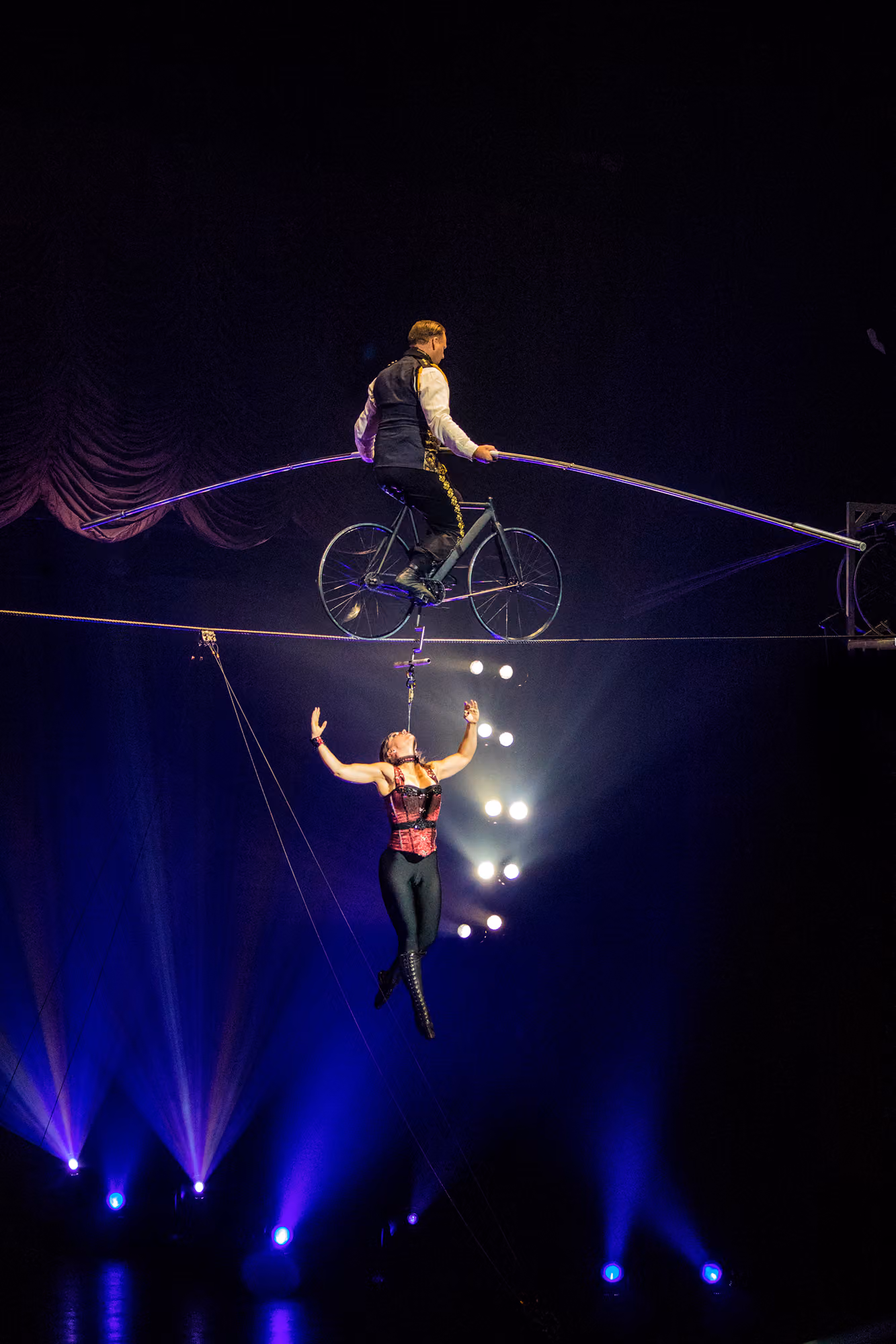 A Wallenda crossing the high wire by bicycle