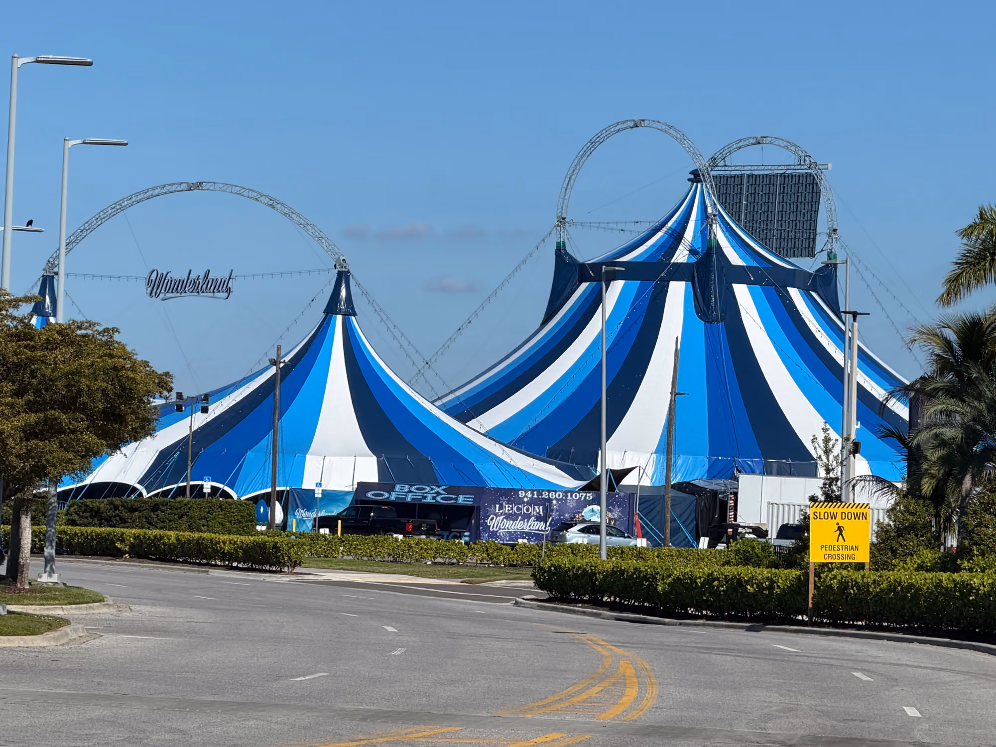 The blue and white striped Wonderland Circus big top with palm trees, Sarasota