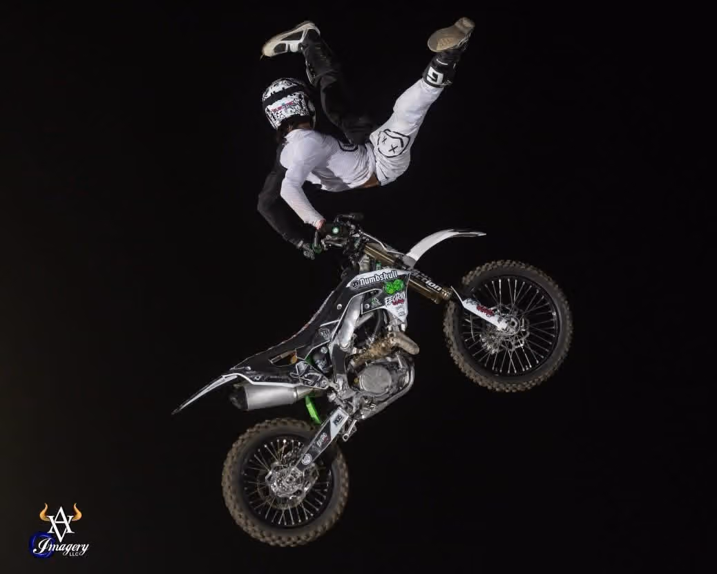 Freestyle motocross rider inverted in mid-air
