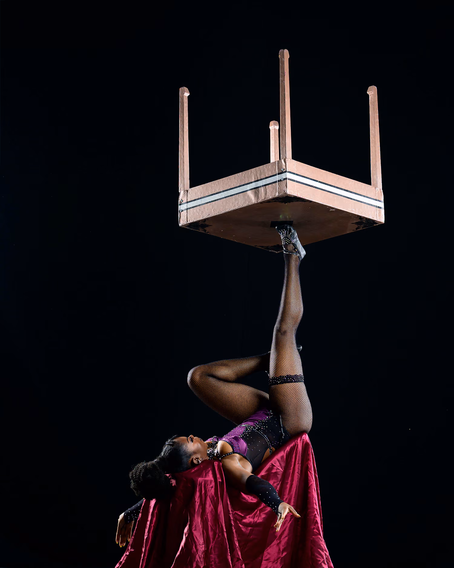 Helen Wonjila performing a foot juggling act