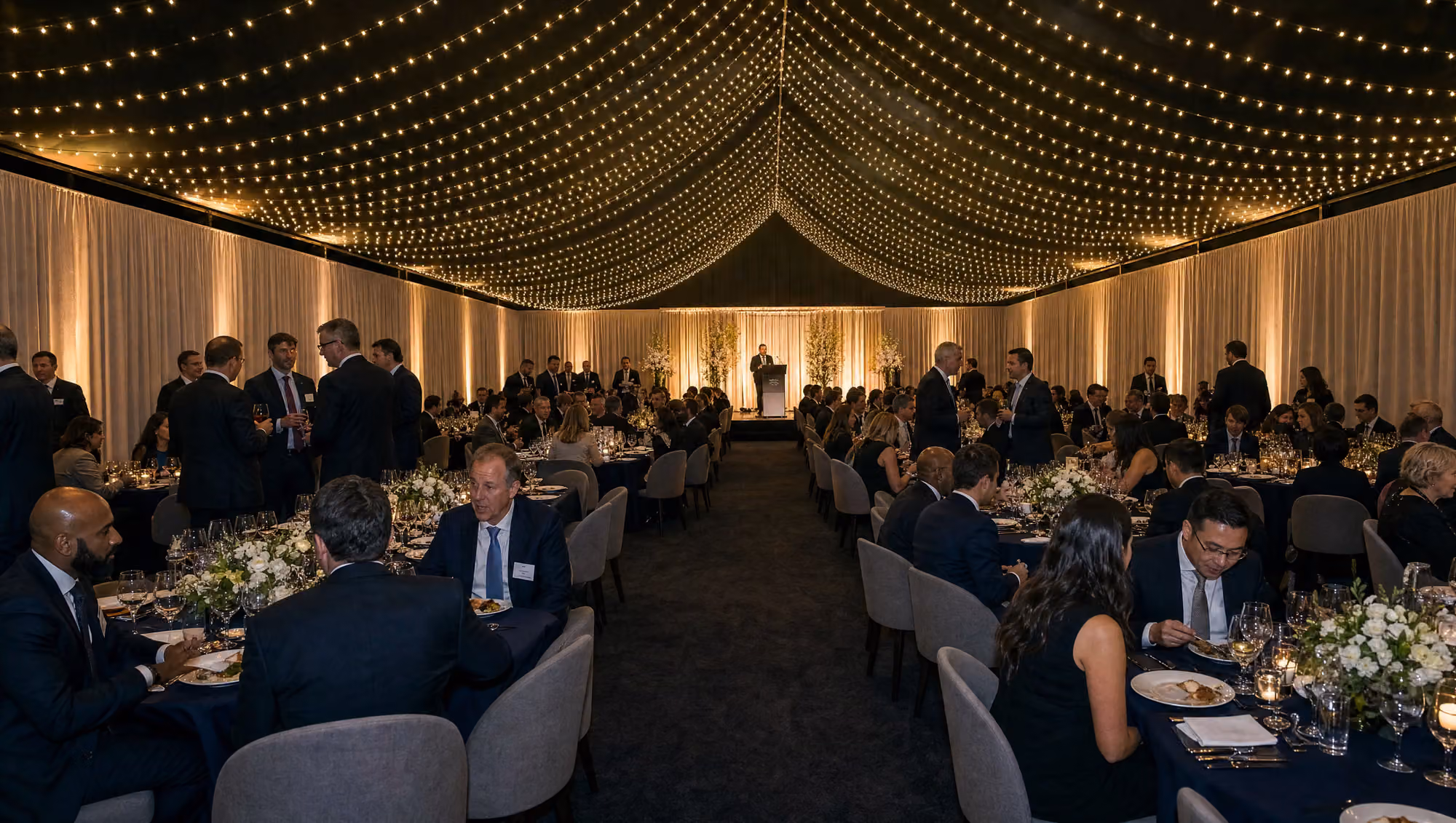 Corporate dinner set inside the 20m by 40m reception pavilion