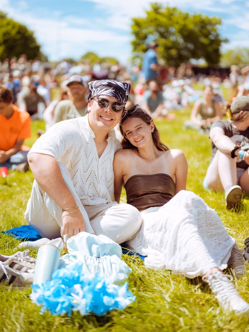 Couple relaxing together on the festival lawn